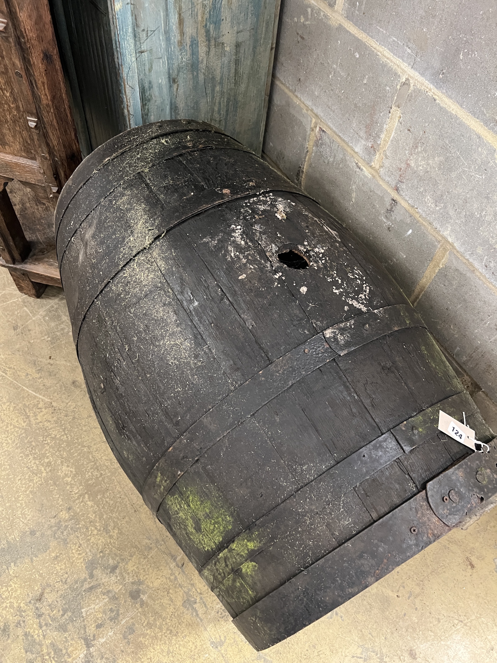 A vintage coopered wine barrel on stand, now converted to a dog's kennel, width 96cm, height 76cm